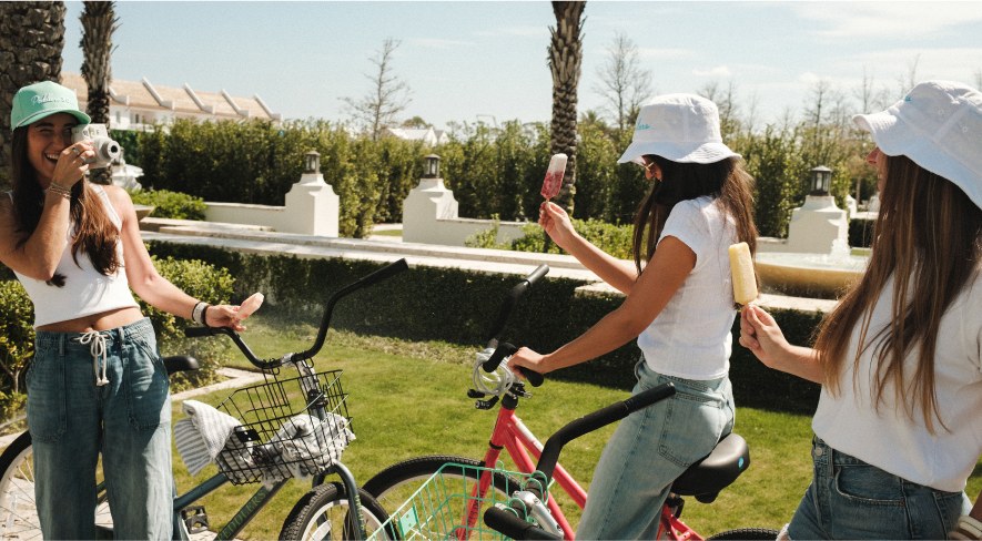 Friends with ice creams beside their bikes